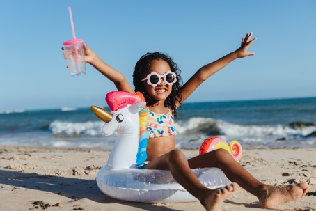 child playing on the beach